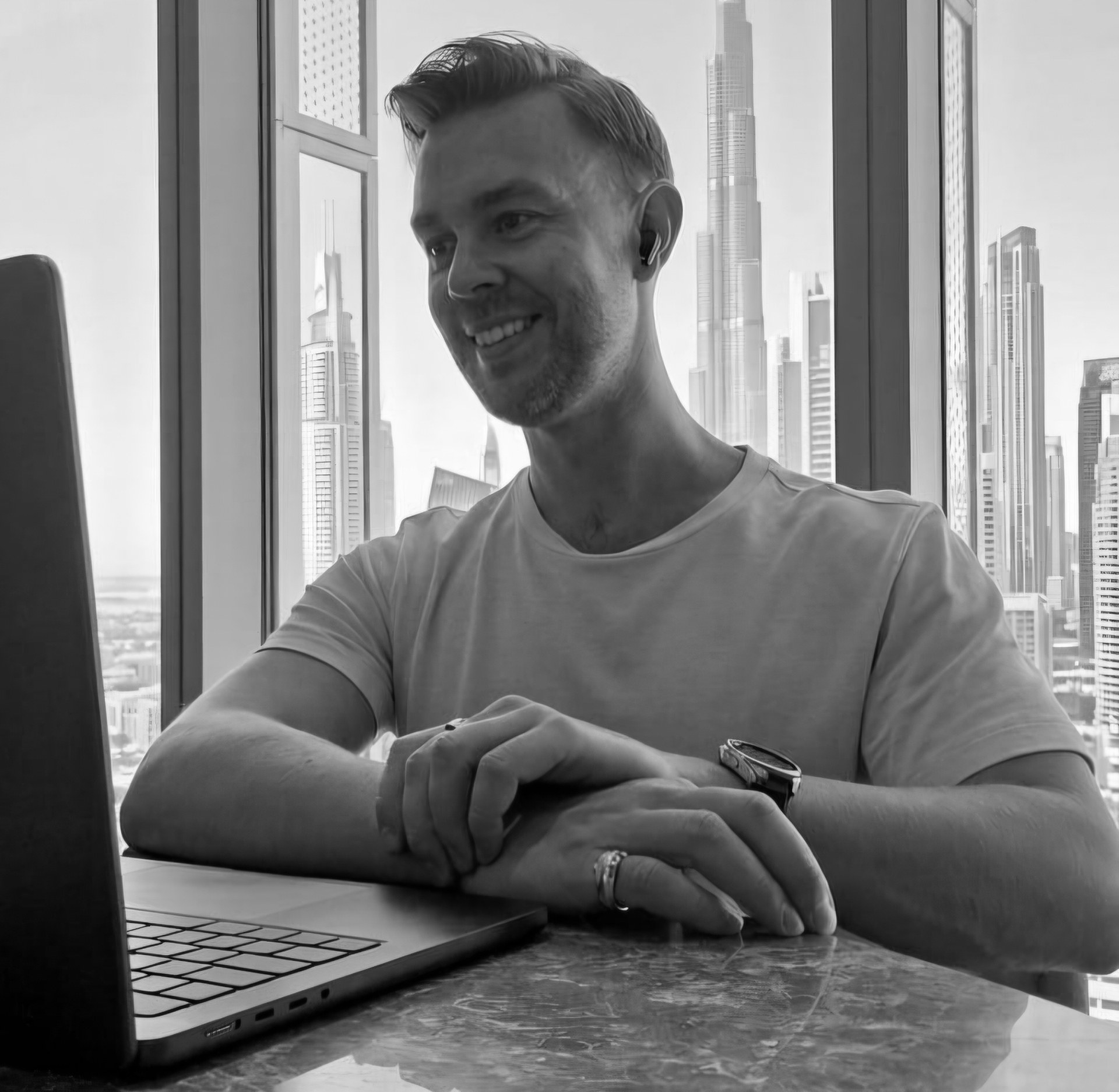 Eric O. Peck working in Dubai with the Burj Khalifa behind