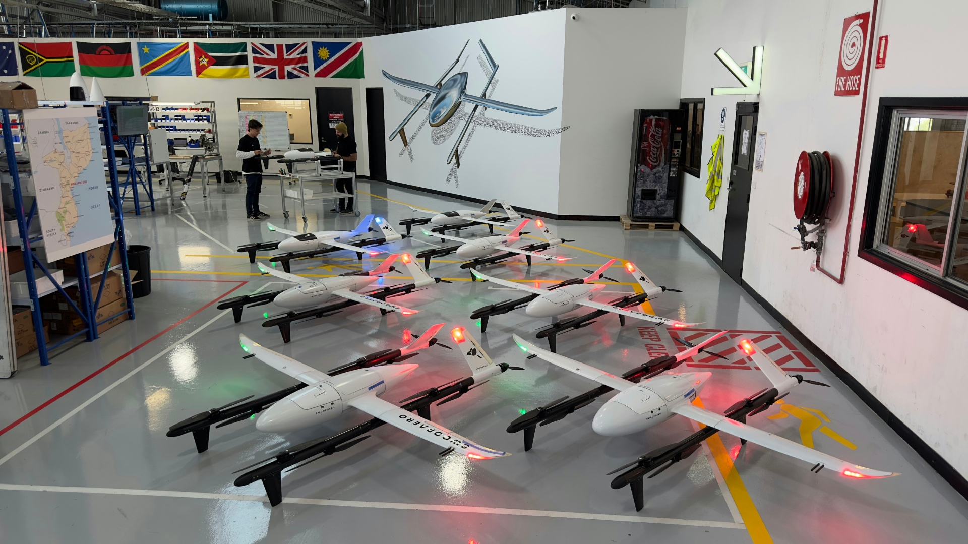 Swoop Aero fleet lined up in the hangar with navigation lights on