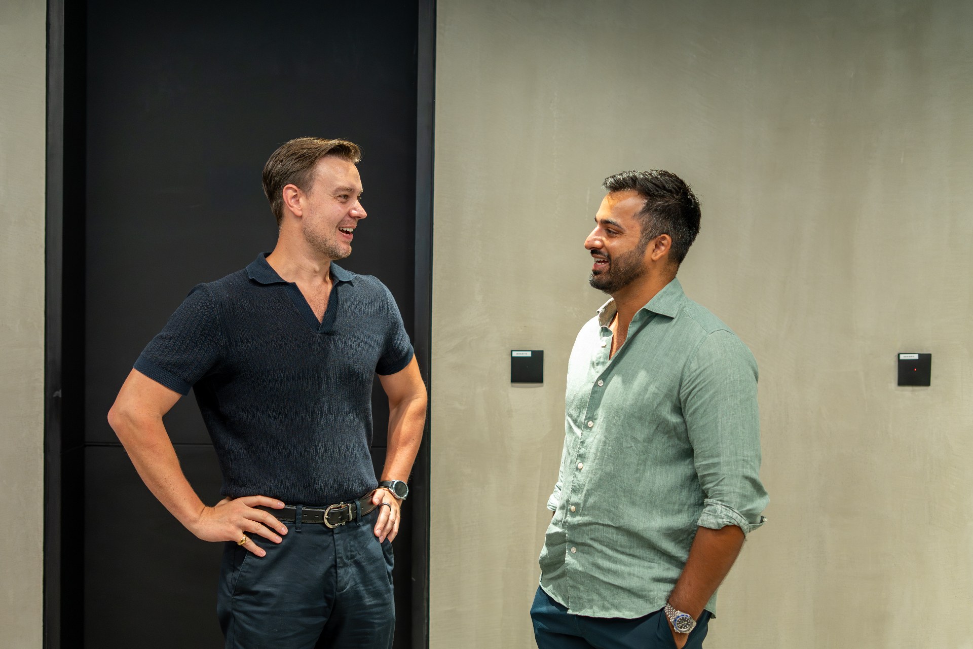 Eric O. Peck in conversation with a founder in an office setting